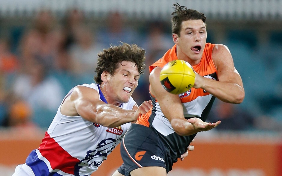 AFL 2016 NAB Challenge - GWS Giants v Western Bulldogs CANBERRA, AUSTRALIA - FEBRUARY 25: Jake Barrett of the Giants and Will Minson of the Bulldogs in action during the 2016 NAB Challenge match between the GWS Giants and the Western Bulldogs at the Manuka Oval, Canberra on February 25, 2016. (Photo by Michael Willson/AFL Media)